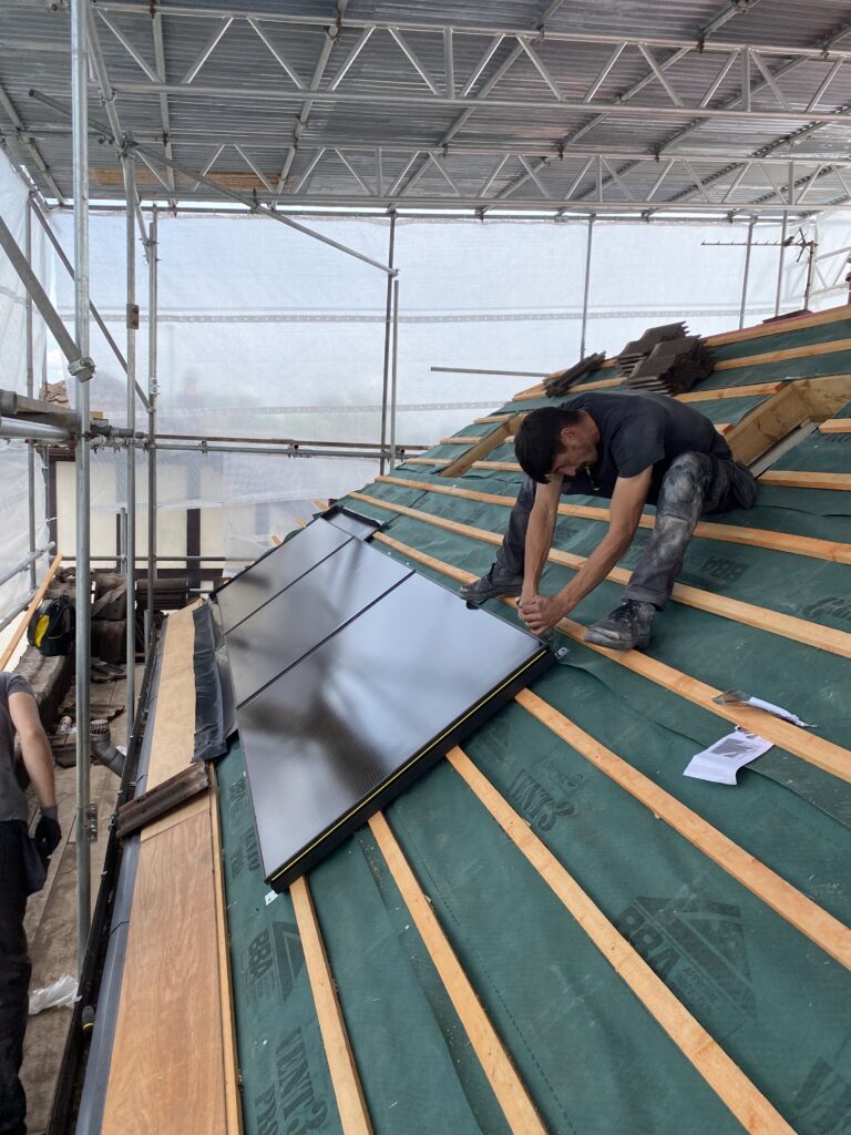 20250613_134754206_iOS - Flux Solar Energy Finishing touches on an in‑roof solar panels in Horwich
