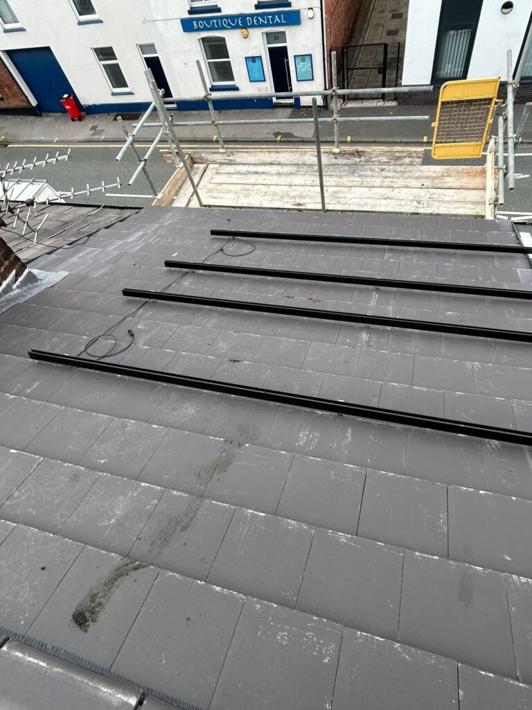 Ashton-in-Makerfield solar installation rails prepared for 3.6 kW solar system – ClickFit EVO rails and tidy cable runs ready for panel installation; durable mounting hardware ensures a long‑lasting array.